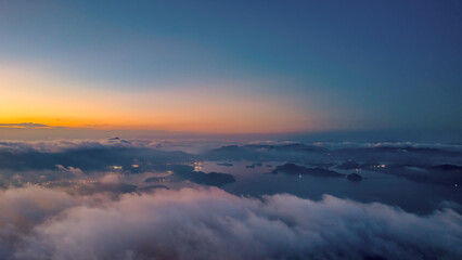 View of a Cityscape at Sunset With Clouds and Urban Buildings