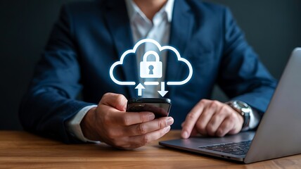 Businessman using smartphone with glowing cloud security icon symbolizing data protection and digital safety on a laptop background