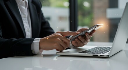 Business Professional Using Smartphone and Laptop