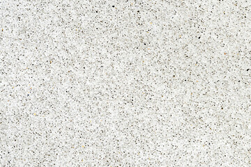 White terrazzo tile texture with black and brown stones