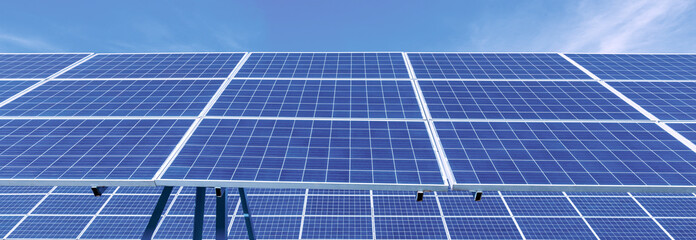 Aerial view of powerful Wind turbine farm for energy production on beautiful cloudy sky at highland. Wind power turbines generating clean renewable energy for sustainable development green energy.