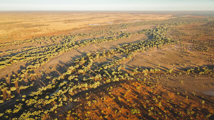 Drone photography of the bush at sunrise inbetween Bedourie and Boulia, Queensland, Australia © pauline.mongarny