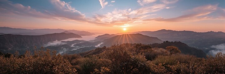 Obraz premium Sunset over a mountain valley.