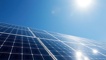 Solar panels under a clear blue sky, representing clean energy and sustainability.