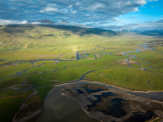 Beautiful curving rivers and green grassland in Litang county, China