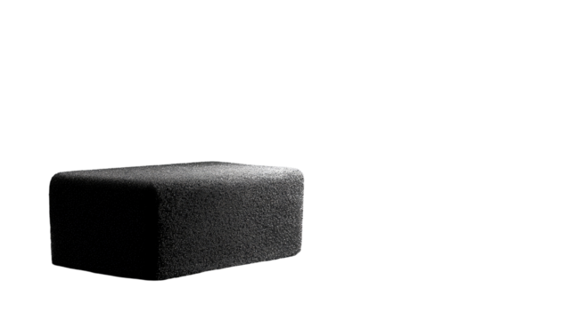 Dark gray, rectangular, textured block.  Isolated against black