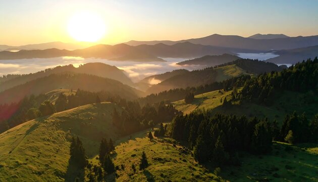 Sunrise over rolling hills and misty mountains