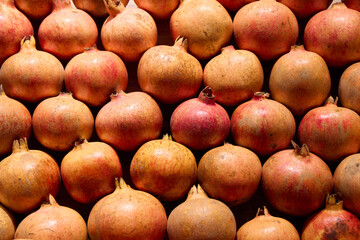 A Vibrant Display Featuring Fresh Pomegranates Arranged Beautifully on a Wooden Surface