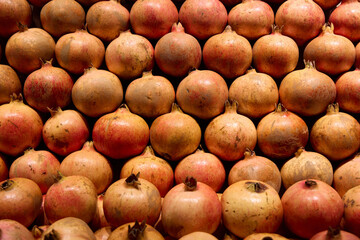 A Variety of Fresh Pomegranates Beautifully Displayed for Sale in the Local Market