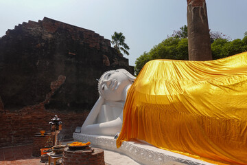 Reclining Buddha wrapped with saffron cloth