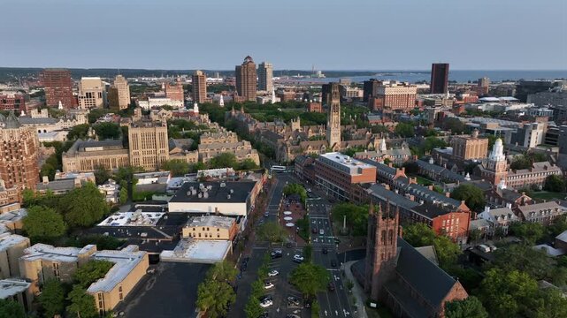 New Haven city in Connecticut at sunset time. Downtown with historic buildings, towers and churches. Brick Design in American town. University campus and