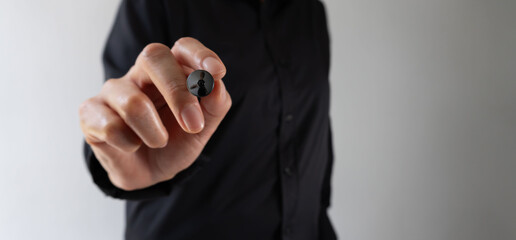 Business person pointing forward with a digital pen