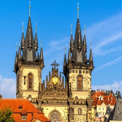Fototapeta premium Two Gothic church towers against a clear sky