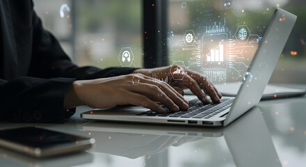 Hands typing on laptop with digital business growth infographics and technology icons overlay