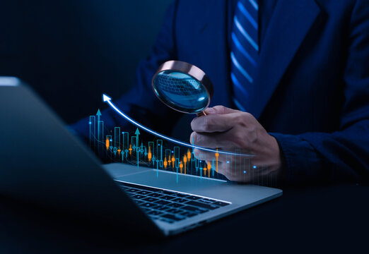 Businessman showing stock market graph, business finance and investment concept, finance, capital, global economic growth, coins, business profit graph, long term investment - Powered by Adobe