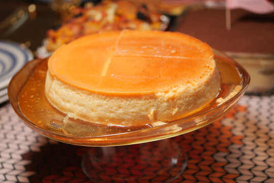 caramel pudding on a glass stand during a celebration