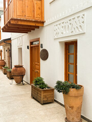 Charming courtyard with decorative pots and wooden doors in a traditional building