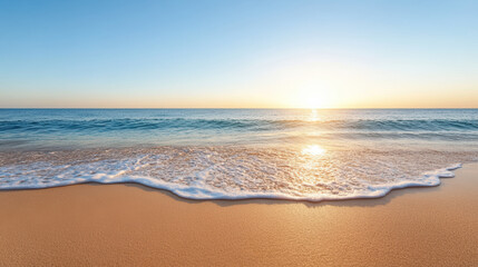 Serene beach scene with gentle waves lapping at shore, showcasing vibrant sunset over ocean