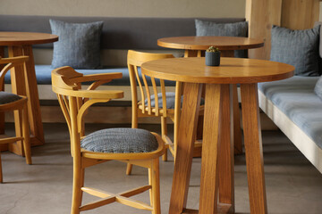 Cozy interior of a modern cafe with wooden furniture