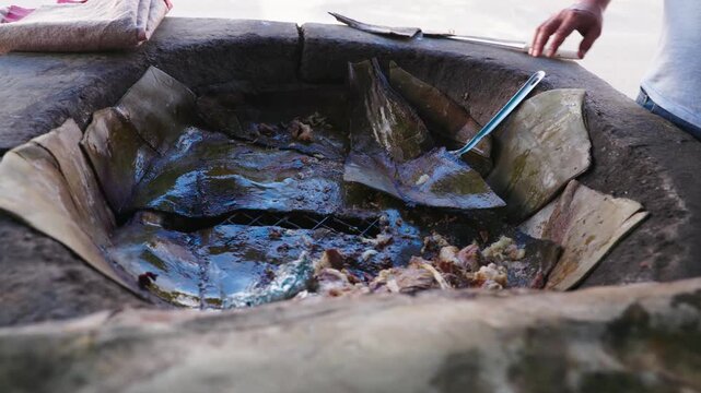 Exploring the Traditional Cooking Process Utilizing a Stone Oven barbacoa