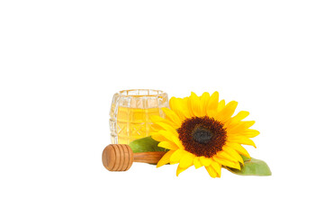Sunflower beside a glass of honey and a dipper, isolated on white, PNG