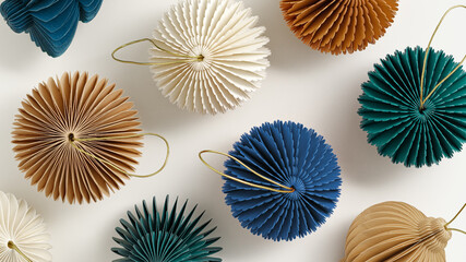 Festive creative colorful pattern of paper Christmas ornaments in various shapes on light white...