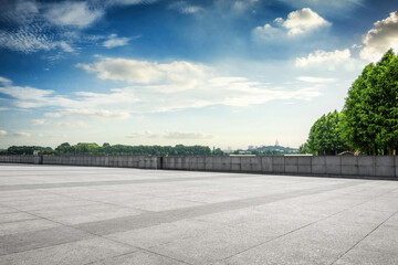 Tranquil Urban Landscape with Expansive Sky and Greenery