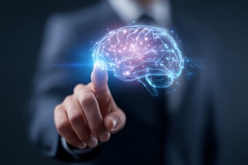 Business professional pointing at a glowing holographic brain, symbolizing AI, intelligence, and digital transformation.