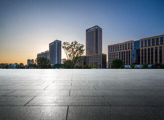 Serene Urban Sunset: Modern Architecture and Open Space