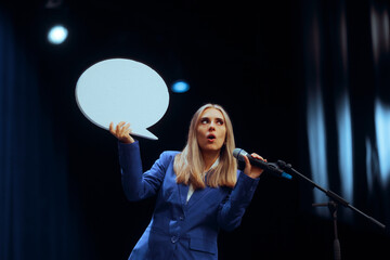 Business Woman Holding a Speech Bubble Making a Presentation. Puzzled speaker trying to deliver the...