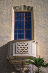 Background of Venetian Architecture with a Sculptured Window and Balcony on an Old Building.