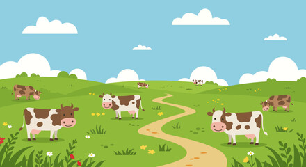 Cows graze on a green grassy field under a blue sky with white clouds with a winding dirt path