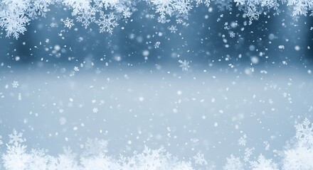 Delicate snowflakes falling against a gradient blue background, creating a winter wonderland scene