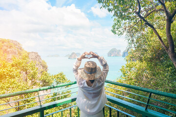Woman tourist traveling in Krabi, Thailand. happy traveller enjoy and sightseeing view at koh Hong...
