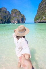 Couple tourist traveling and sightseeing in Krabi, Thailand. happy traveller enjoy at Maya Bay...