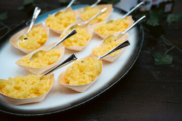 Elegant Portions of Creamy Risotto in Tasting Spoons on Tray