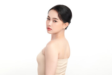 Fototapeta premium A beautiful young Asian woman with clean, fresh skin against a white background. Skincare, facial treatment, cosmetology, beauty, and spa. An elegant portrait of an Asian woman.