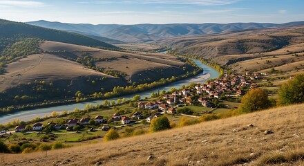 Scenic Village and River in Mountain Valley Landscape