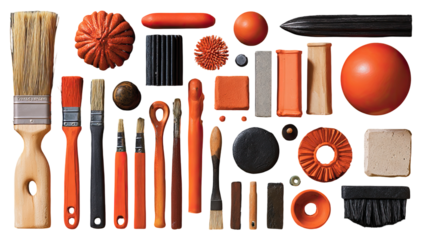 Assorted orange and black art tools arranged in a grid