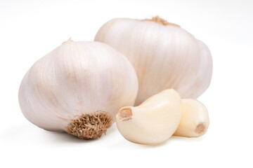 front view fresh peeled garlic cloves, bulb with garlic slices isolated