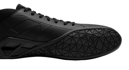 Closeup of a sleek modern black athletic shoe on white background.