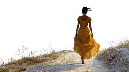 Woman in yellow dress walking in sunlight
