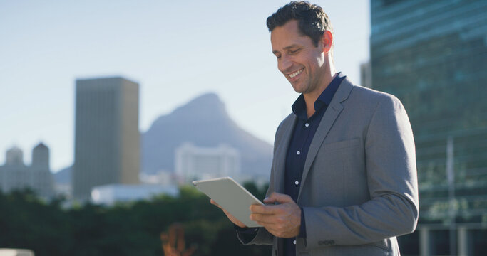 Smile, businessman and city with tablet for research, social media or networking. Man, entrepreneur or real estate agent with reading, tech and scrolling or online search in urban town for contact