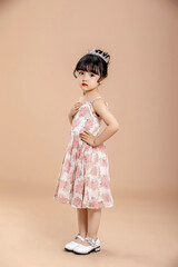 An Asian girl in a flowery dress