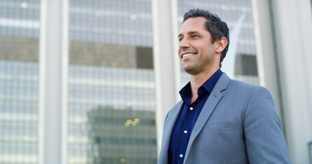 Business man, thinking and smile in city for property viewing, idea and planning outdoor. Urban...