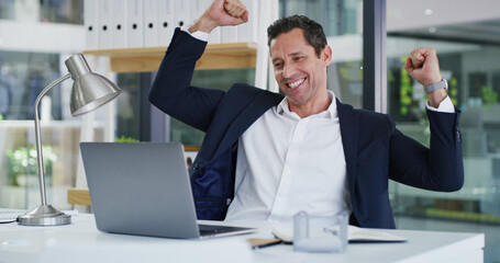 Fist pump, laptop and businessman in office for good news, winning or job promotion on email....