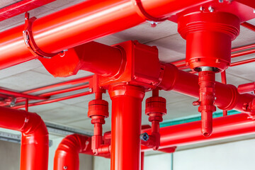 Bright red sprinkler system in a modern building interior Generative AI