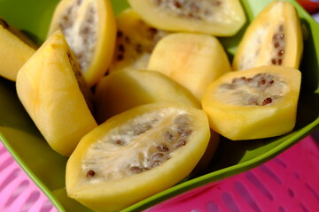 Carica fresh peaches on a plate