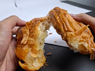 Torn Butter Croissant Revealing Flaky Layers
