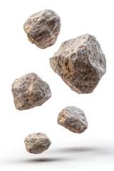Rough, light gray rocks levitate, appearing to fall, against a white background